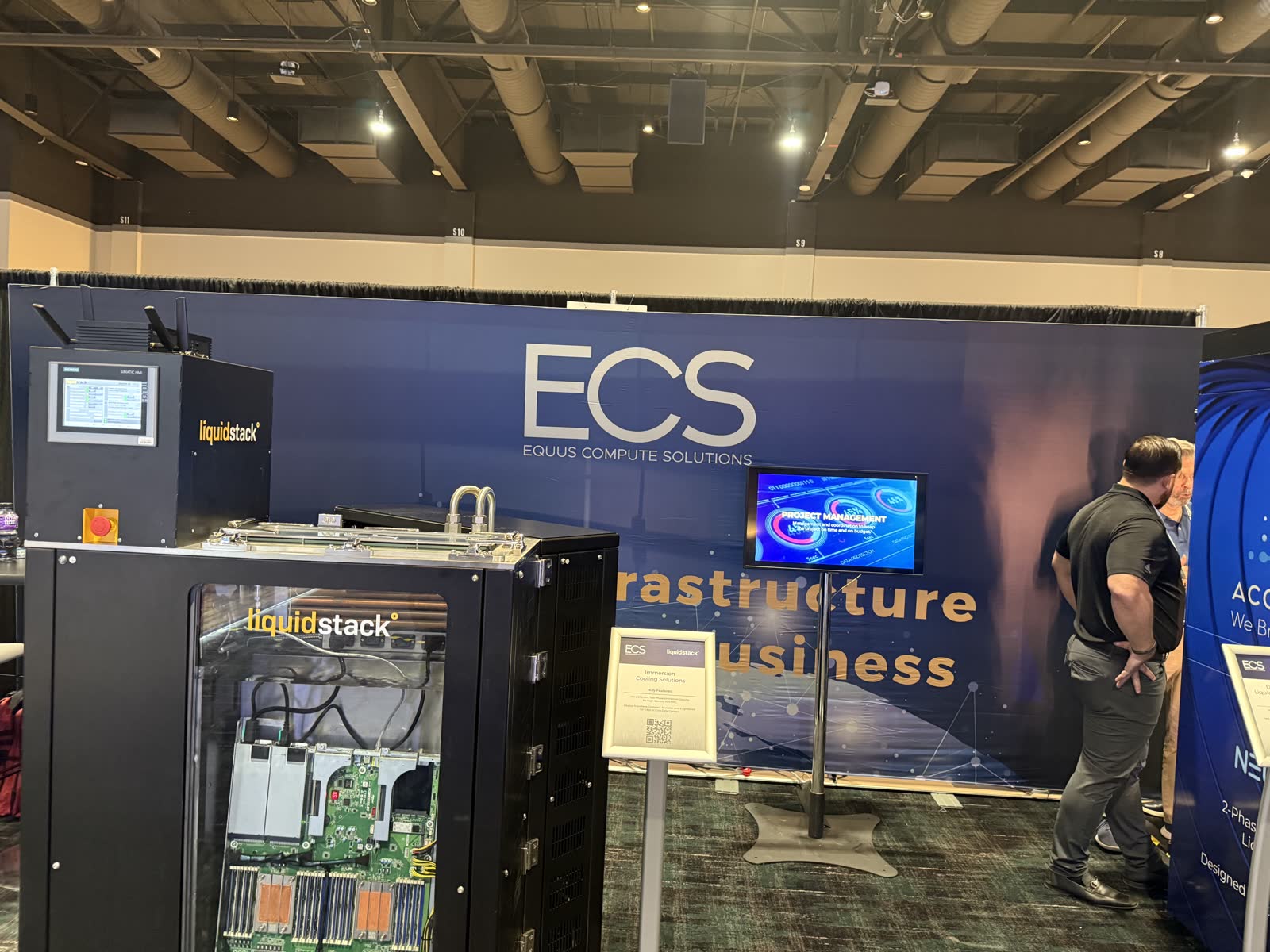 Printed fabric backwall set up at an indoor convention booth
