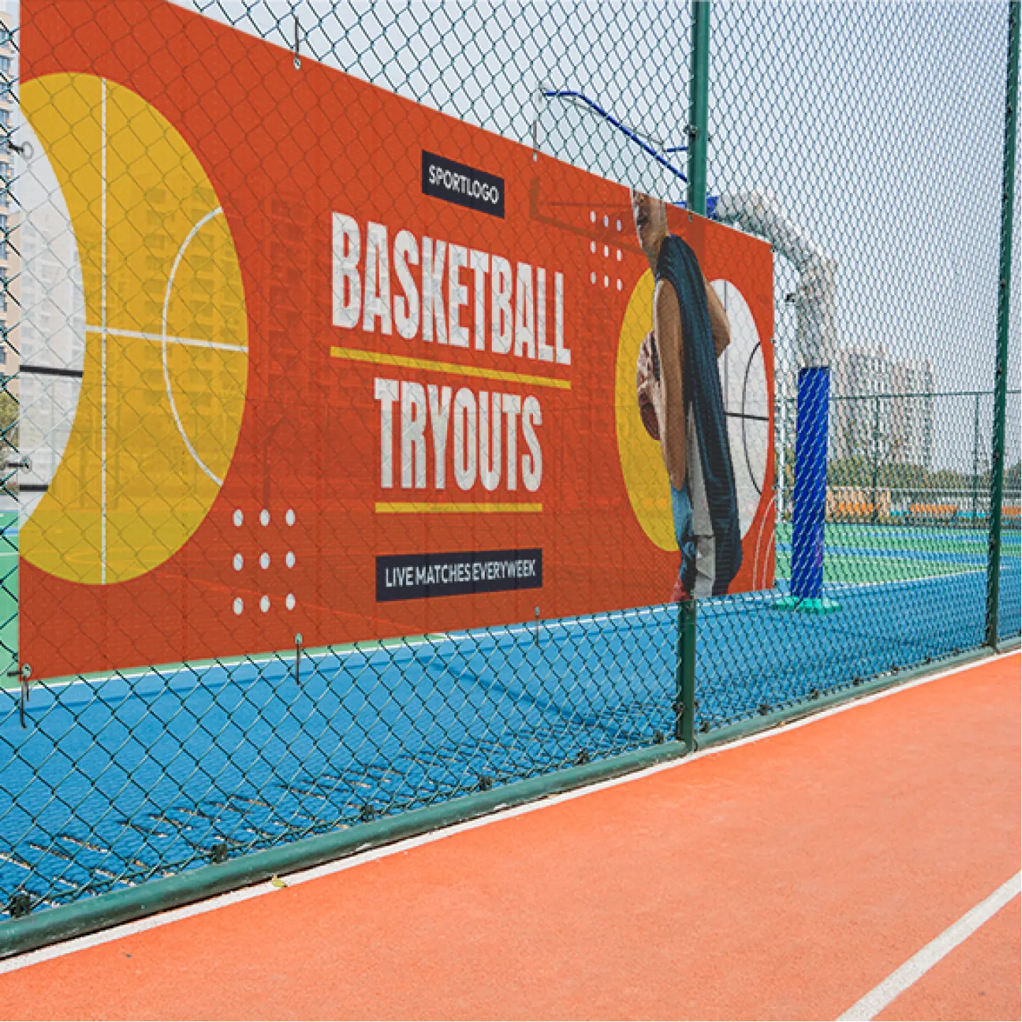 Mesh banner printed full color and grommeted, hung on an outdoor chain-link fence for a basketball tryout event