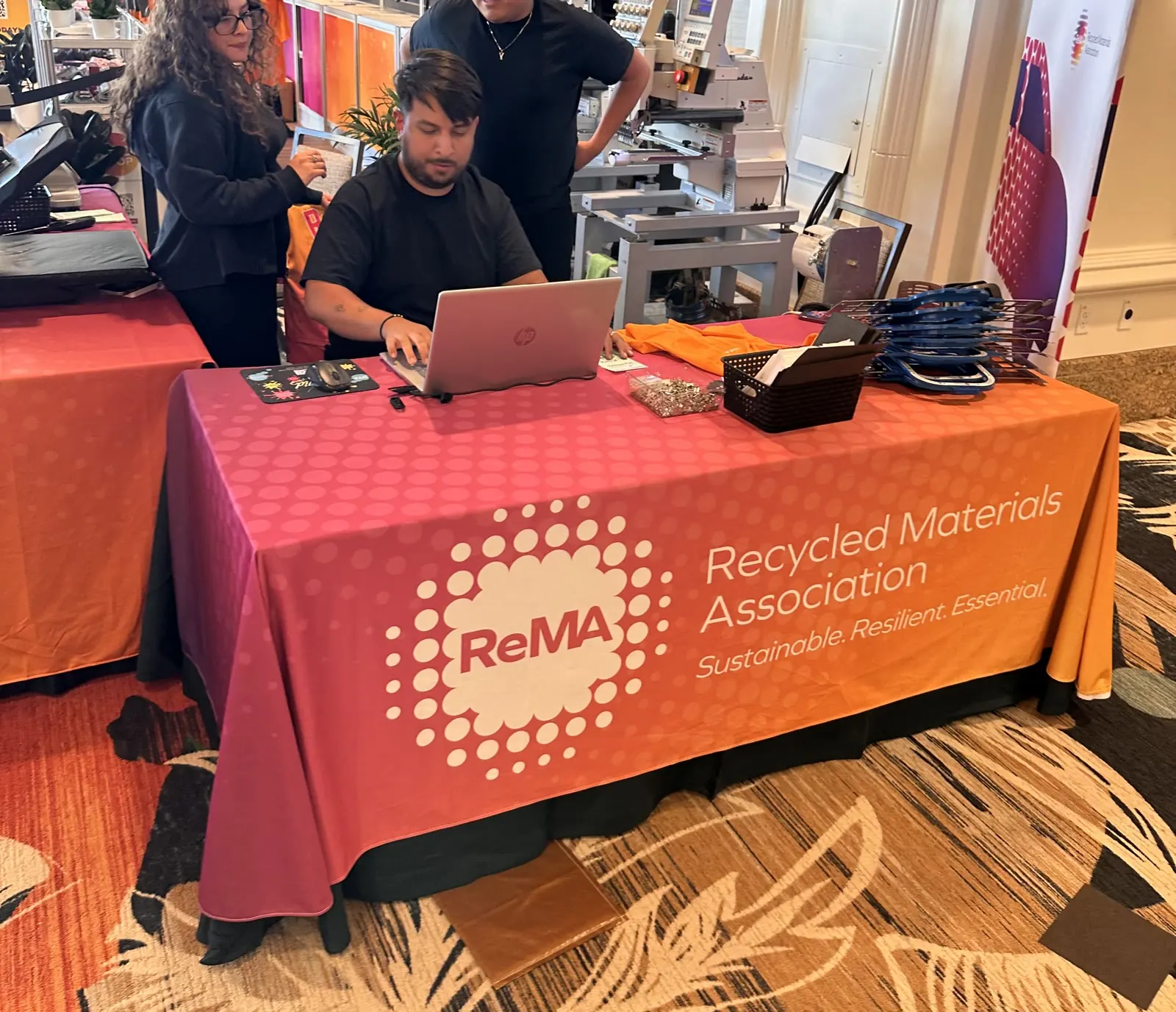 Branded full-color table cover on a trade show registration table at a Las Vegas convention