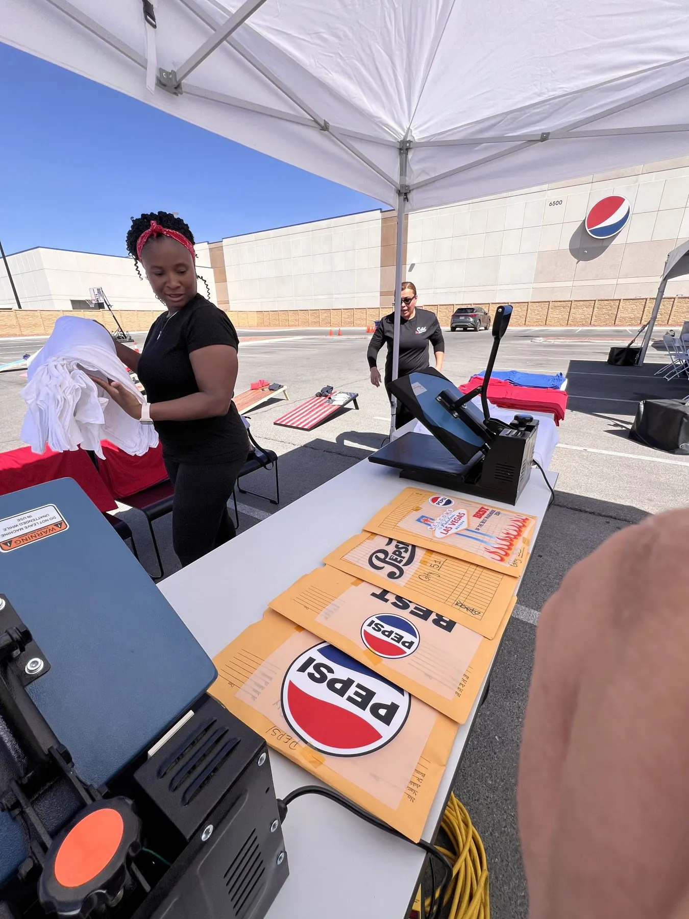 Custom DTF transfer pressed live onto a t-shirt at a Vegas activation
