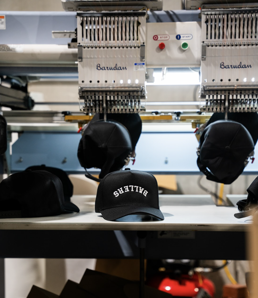 Embroidered snapback cap program on Barudan multi-heads