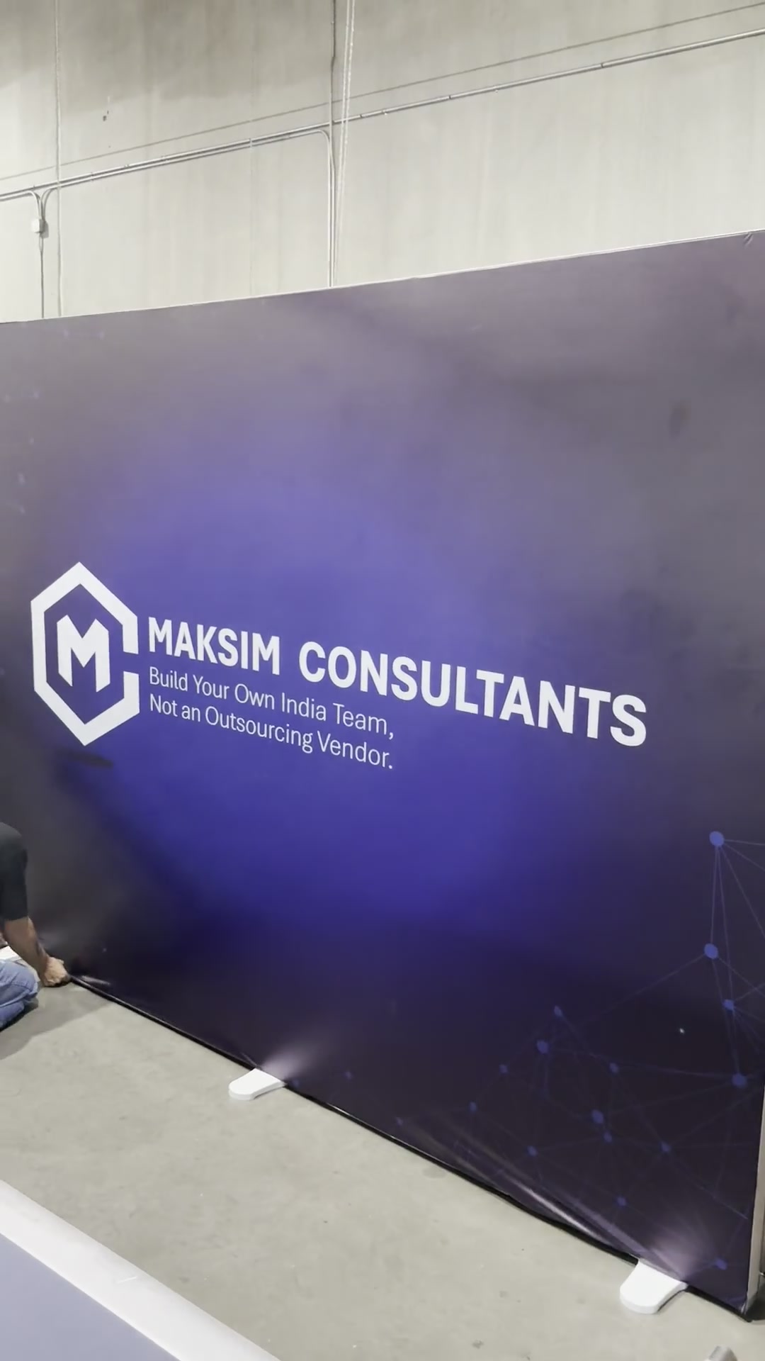 Backlit SEG fabric light box display glowing on a Las Vegas convention floor