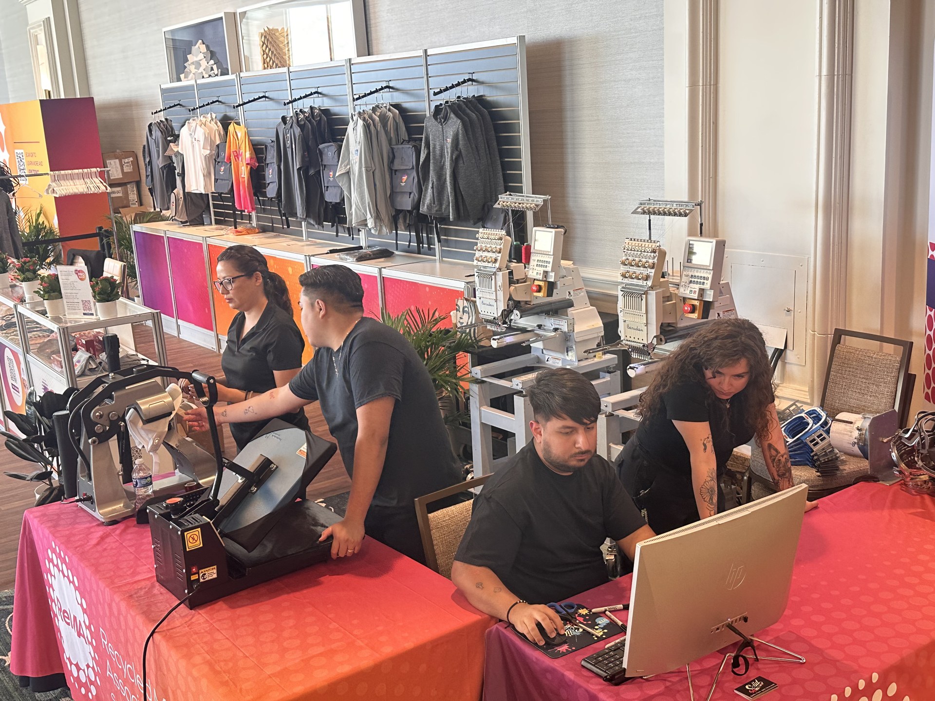 Live heat-press station applying a custom full-color transfer at a Las Vegas brand activation