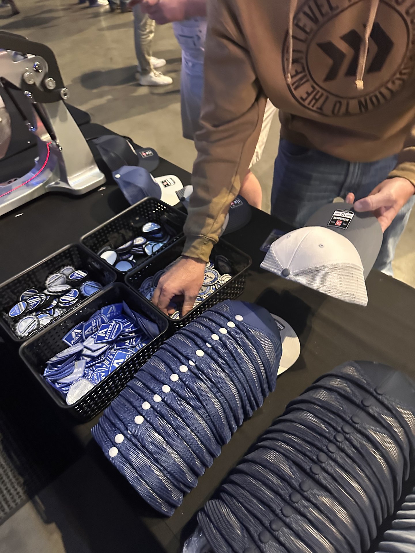 Fresh heat-pressed branded apparel handed off to a guest at a Las Vegas brand activation