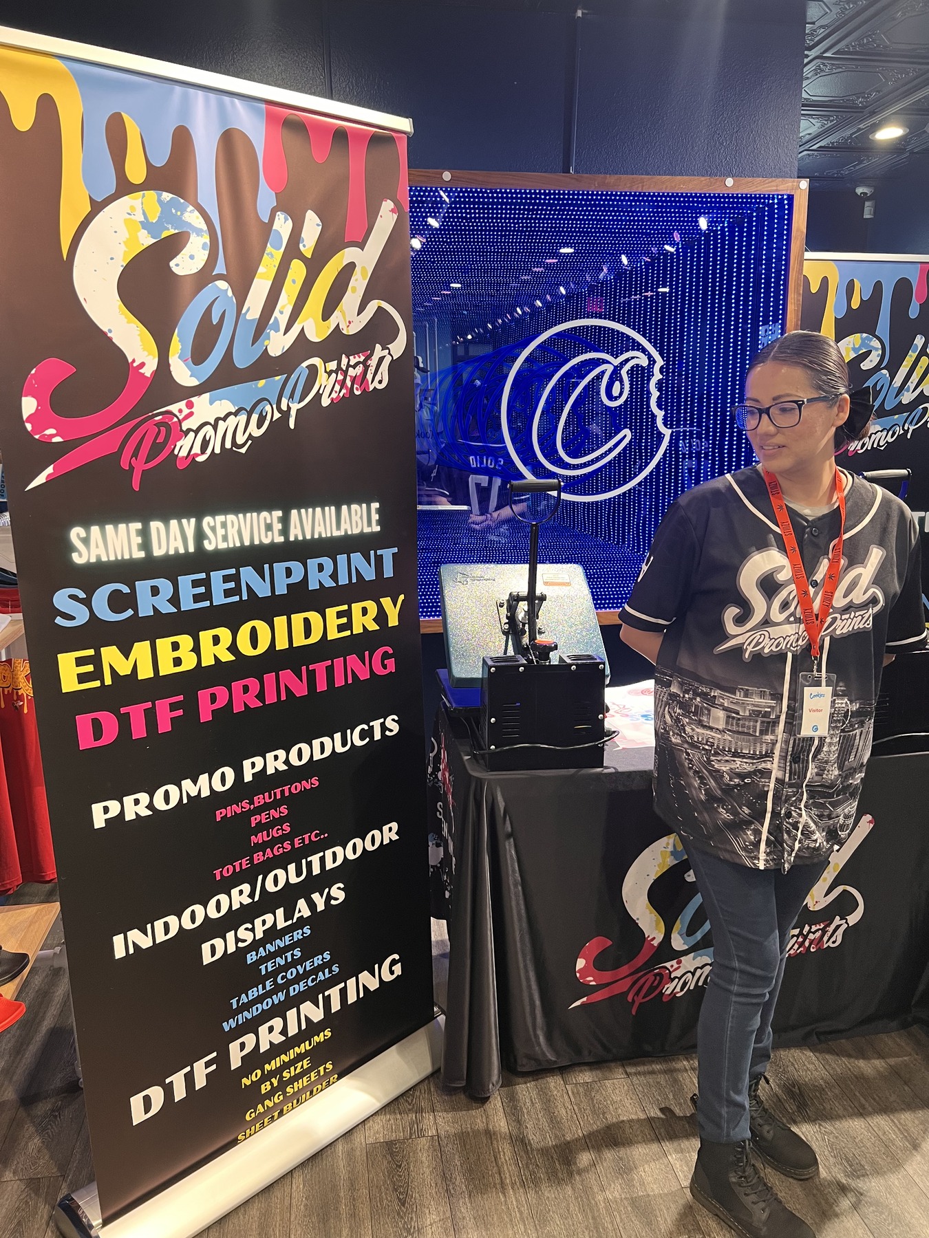 Fresh heat-press transfers applied to apparel at a Vegas brand activation