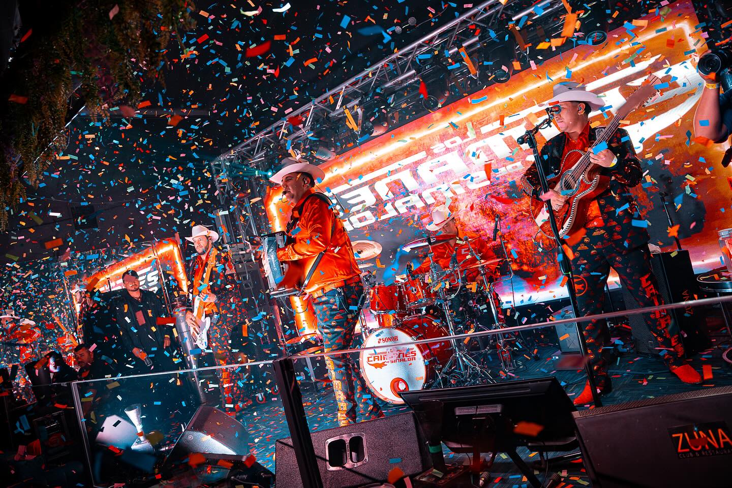 Los Canelos de Sinaloa performing under confetti and LED walls at Zuna Club & Restaurant Las Vegas — nightlife venue branding and live event production