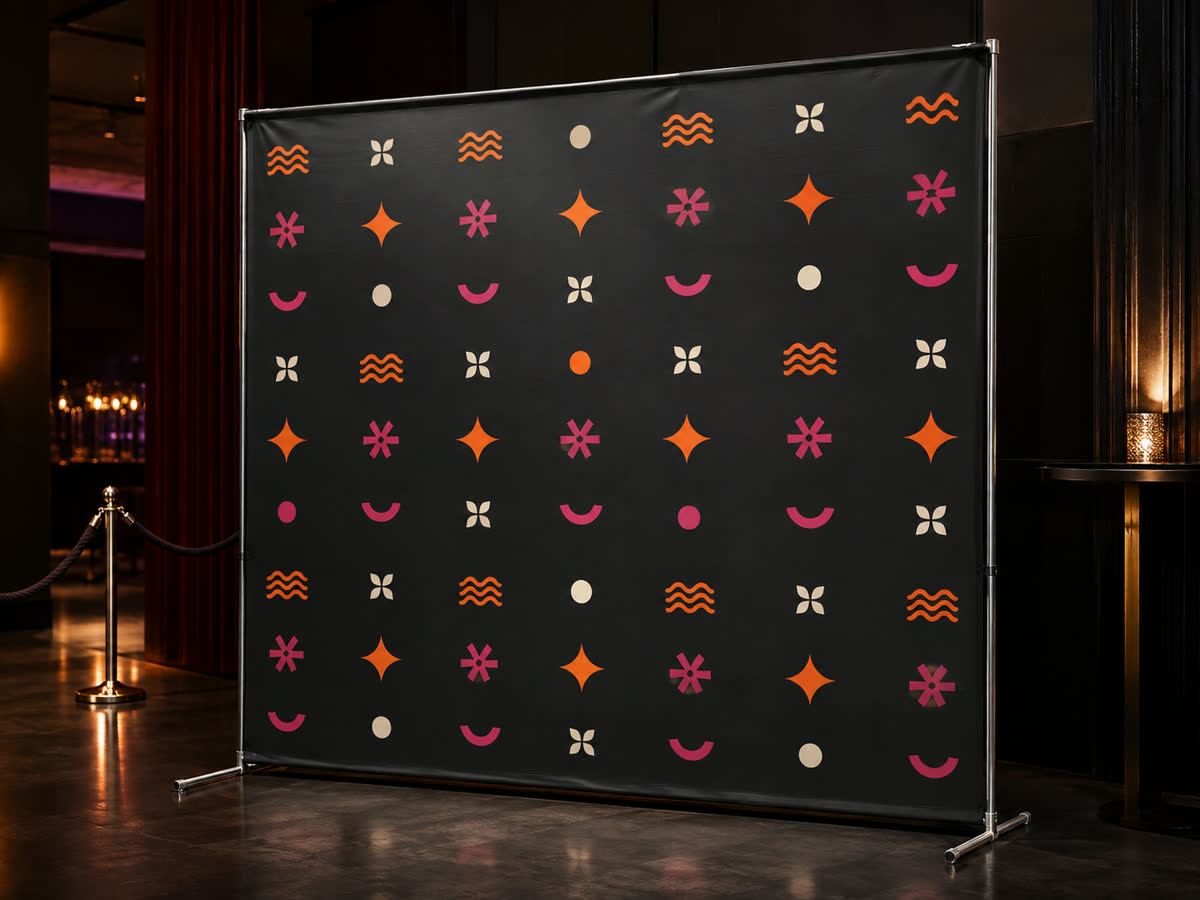 Custom step-and-repeat backdrop on a frame at an event, representative product image