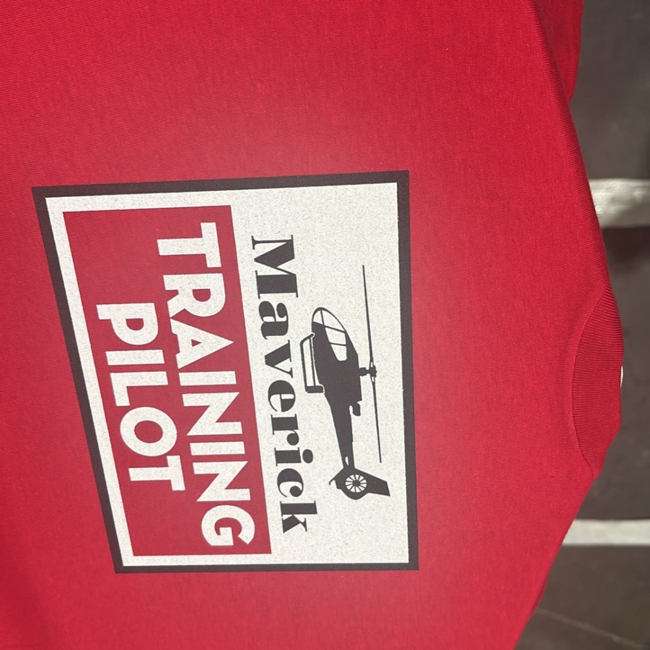 Maverick Helicopters Training Pilot crew tee screen printed on red cotton in Las Vegas