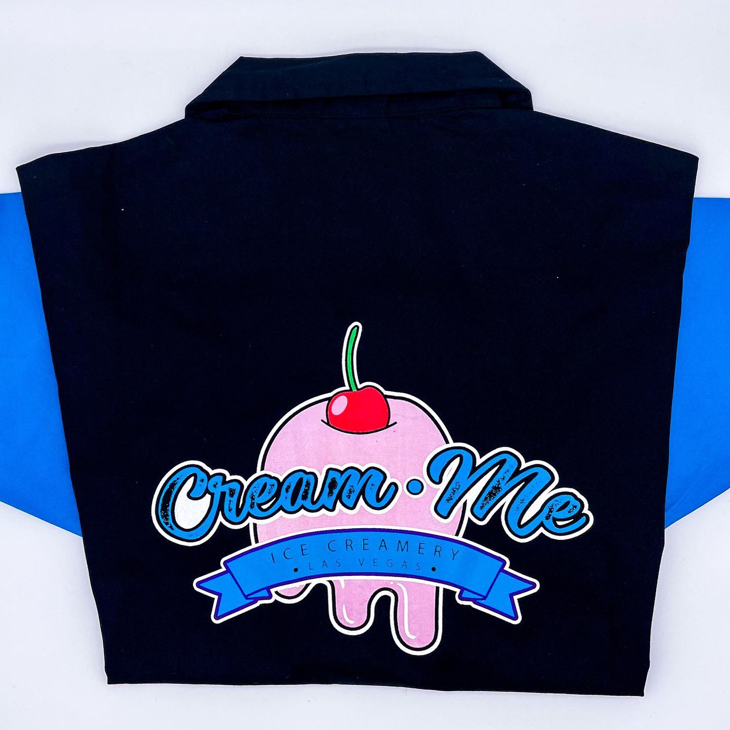 Cream Me Ice Creamery Las Vegas - large-format DTF back print of the dripping ice-cream logo on a black/blue bowling-style staff shirt