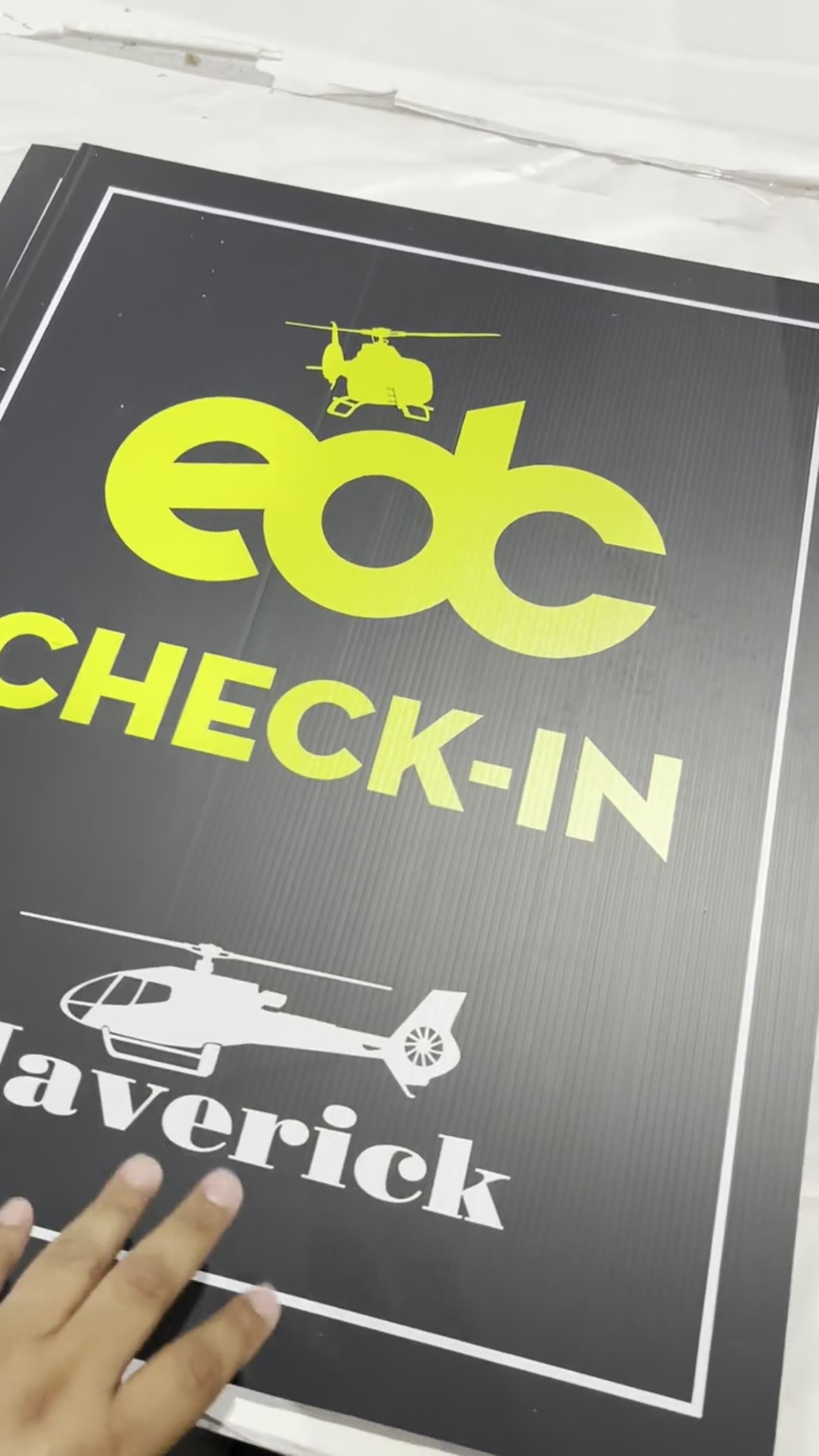 4 mm coroplast signs printed for the EDC check-in at a Las Vegas event, stacked on the Solid Promo Prints production table