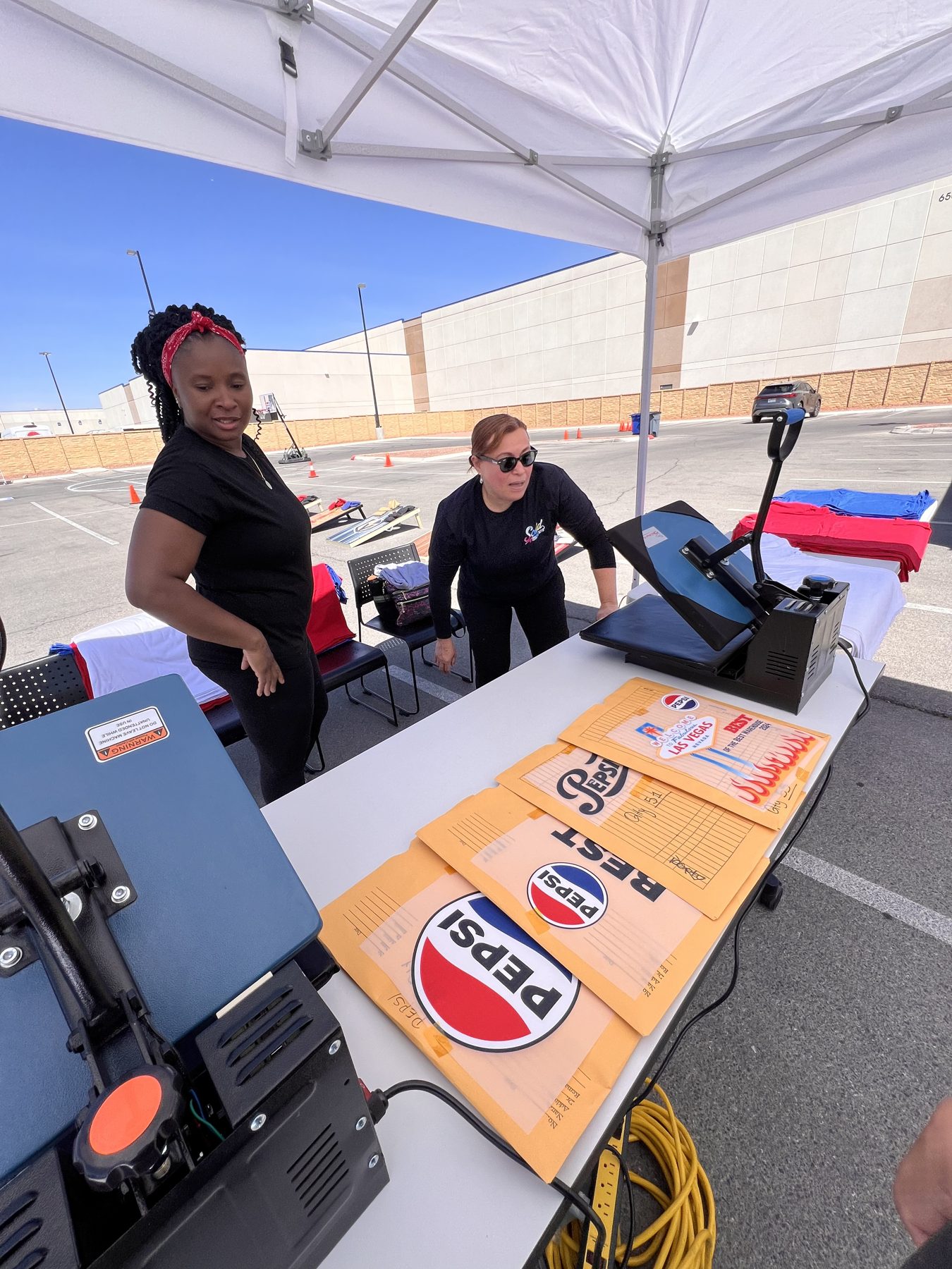 Heat-pressed custom apparel pressed on-site at a Vegas activation
