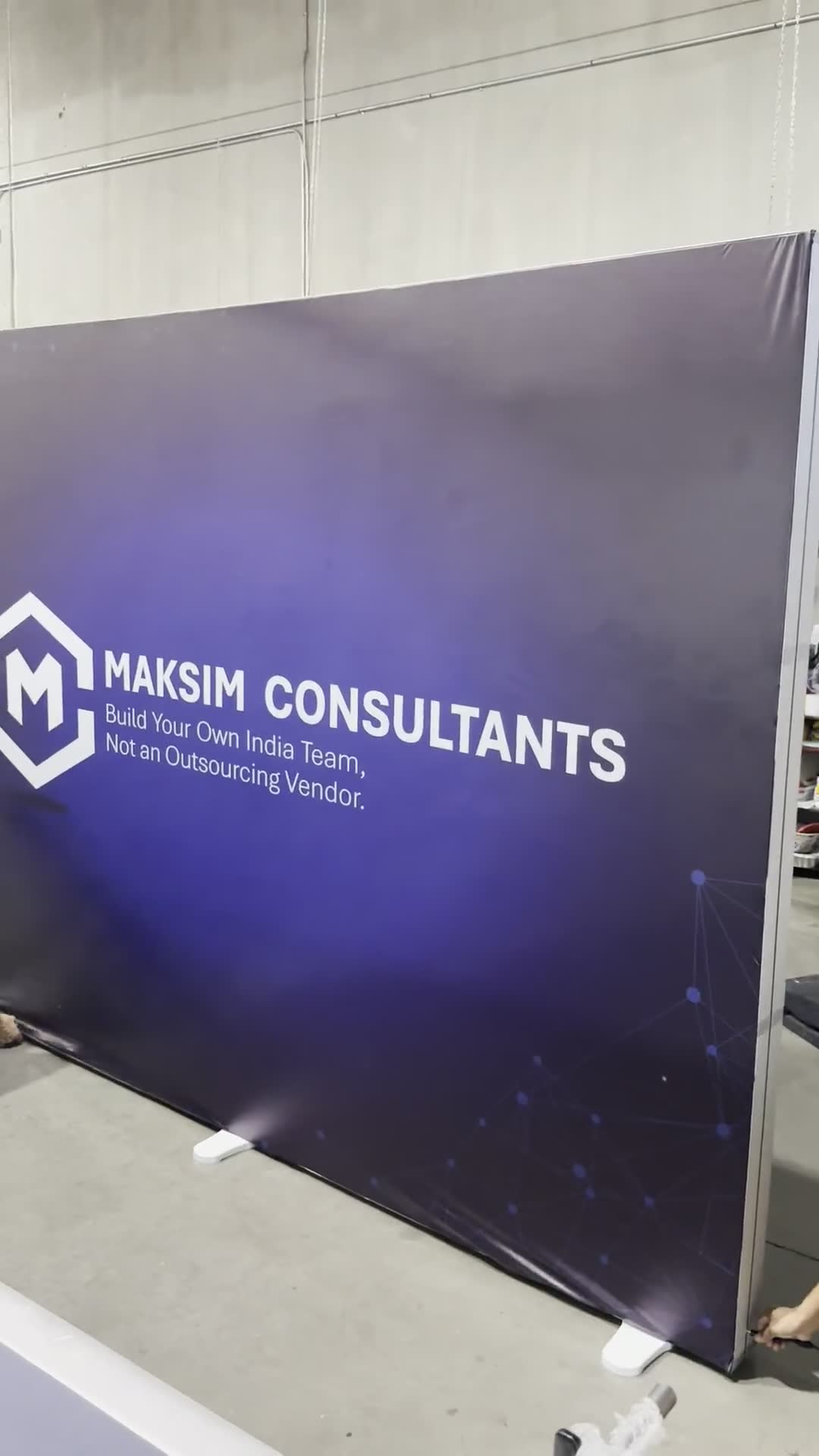 Video of a SEG fabric display frame being built and the silicone-edge graphic pushed into the channel