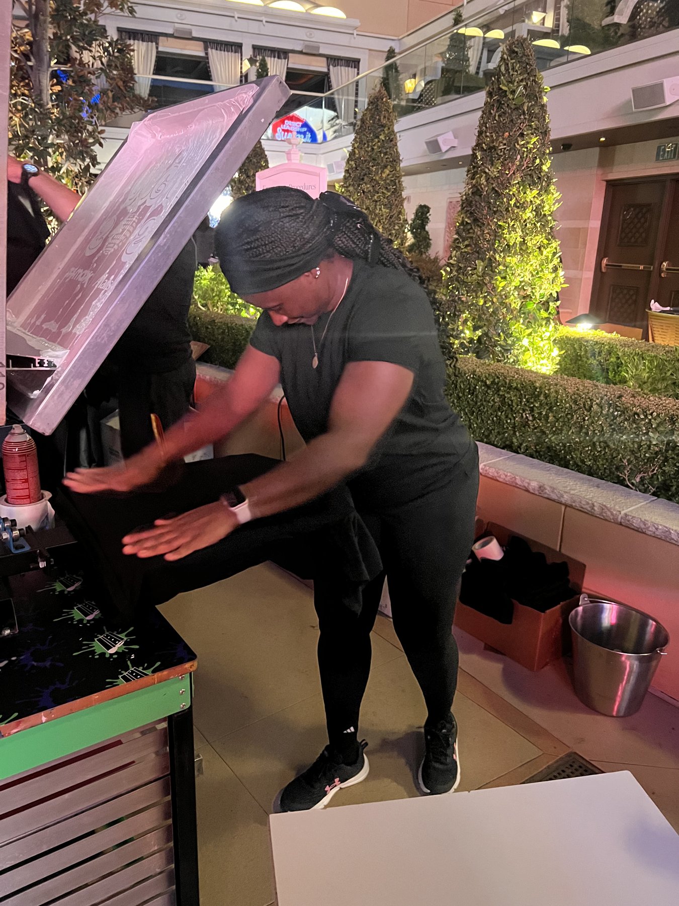 Custom shirts pulled fresh off the press at a Vegas on-site activation