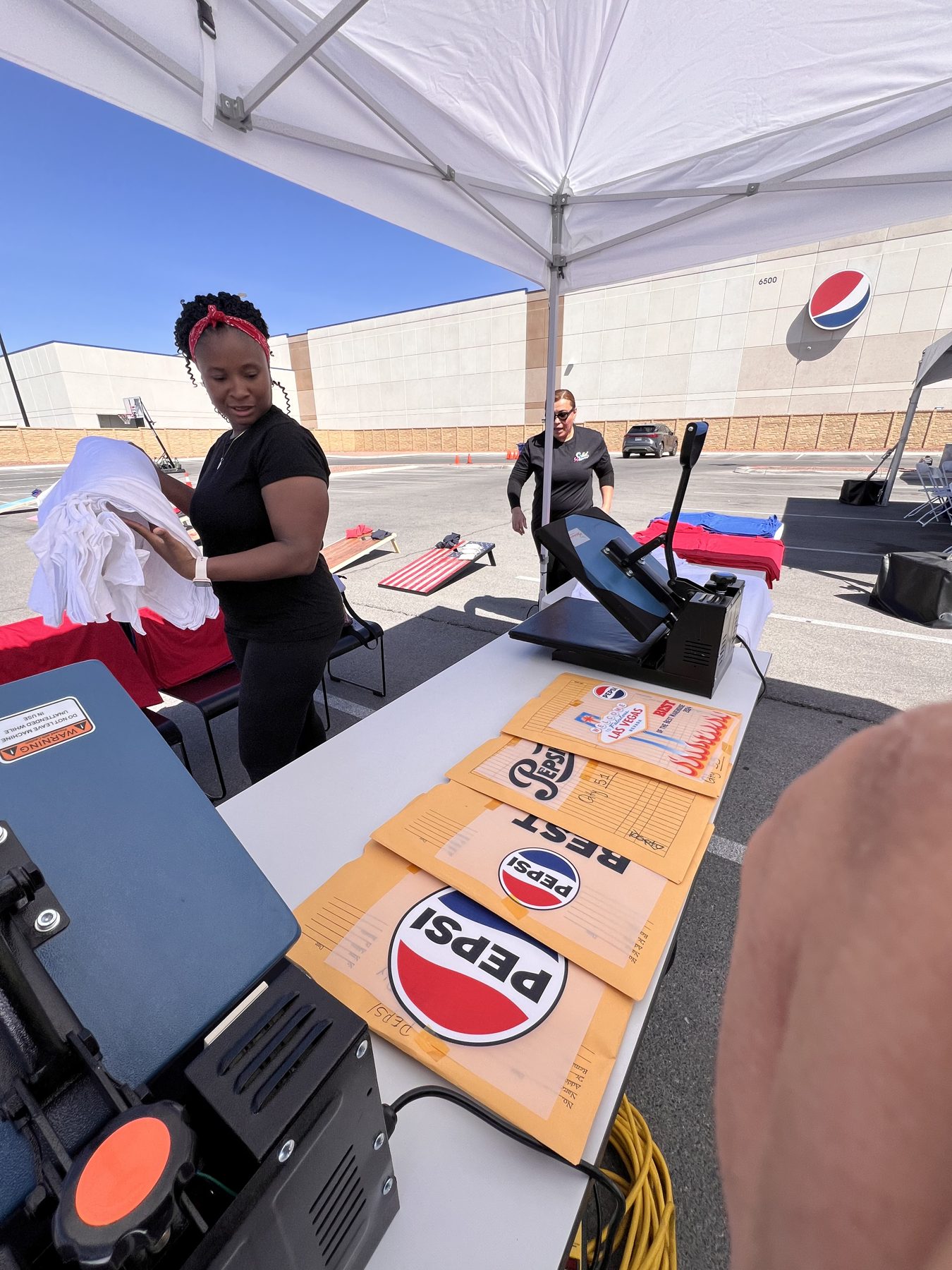Custom DTF transfer pressed live onto a t-shirt at a Vegas activation