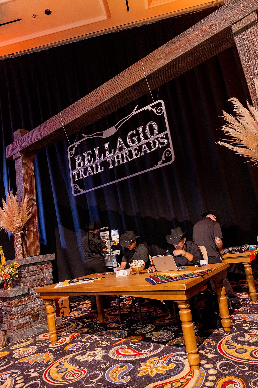 Bellagio Trail Threads live embroidery activation — branded booth with custom signage at the Bellagio $2M Slot Tournament in Las Vegas