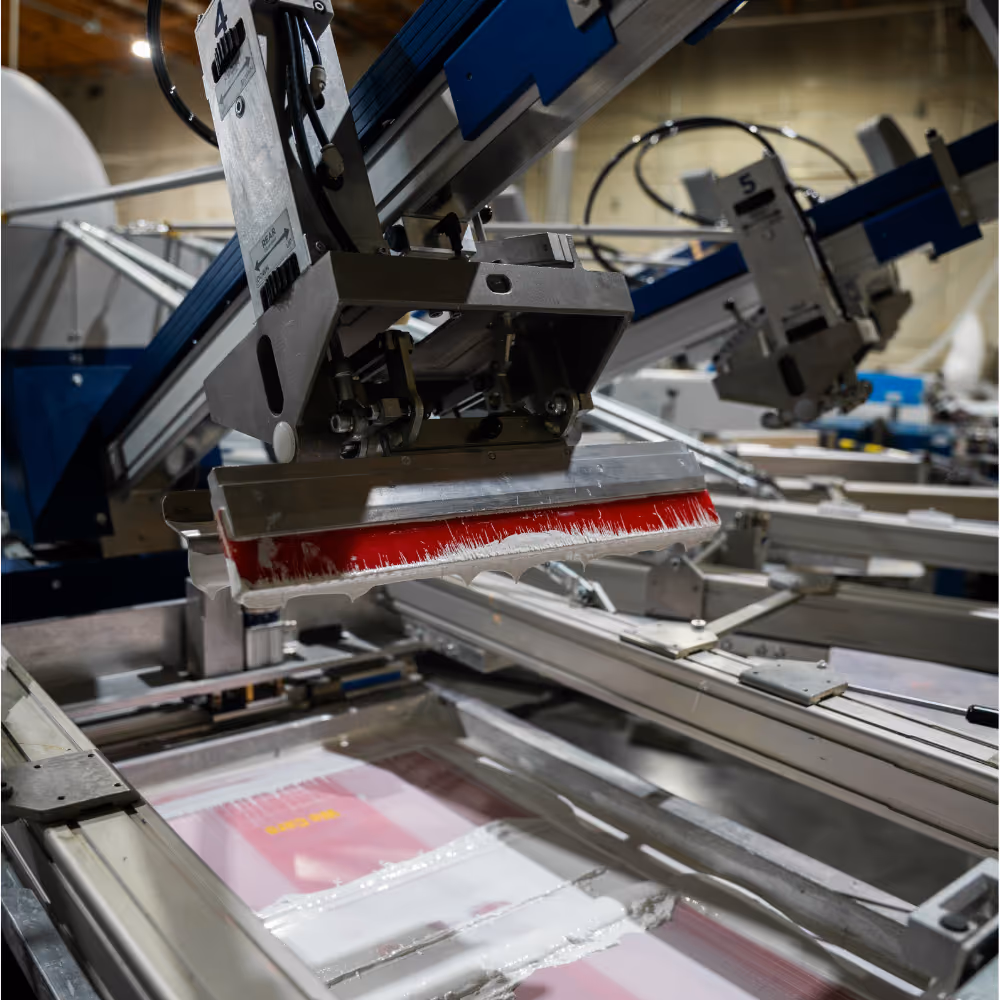 Screen printing production shot with squeegee action